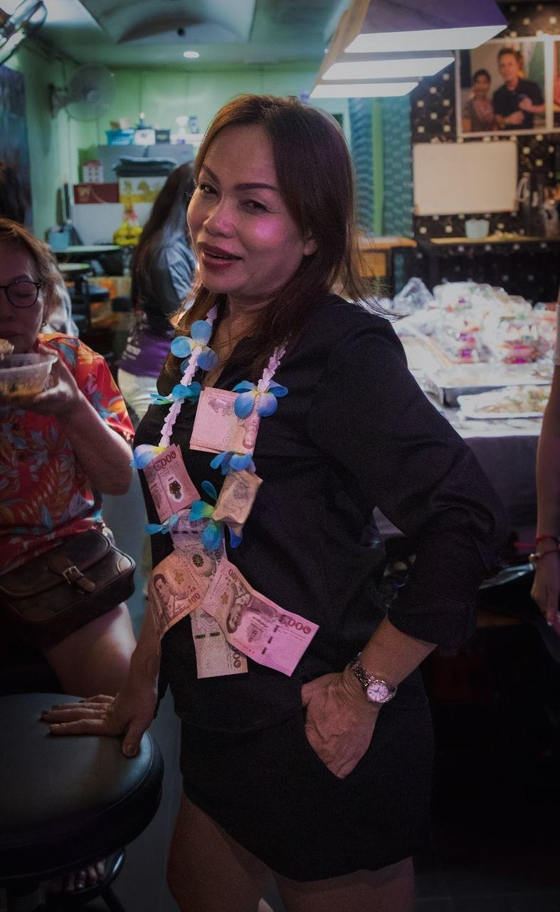 Decked out in a birthday money garland, striking a pose