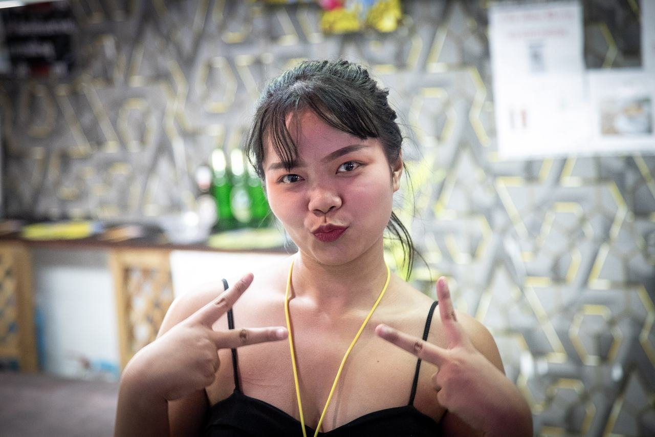 A playful pout and peace signs for the camera
