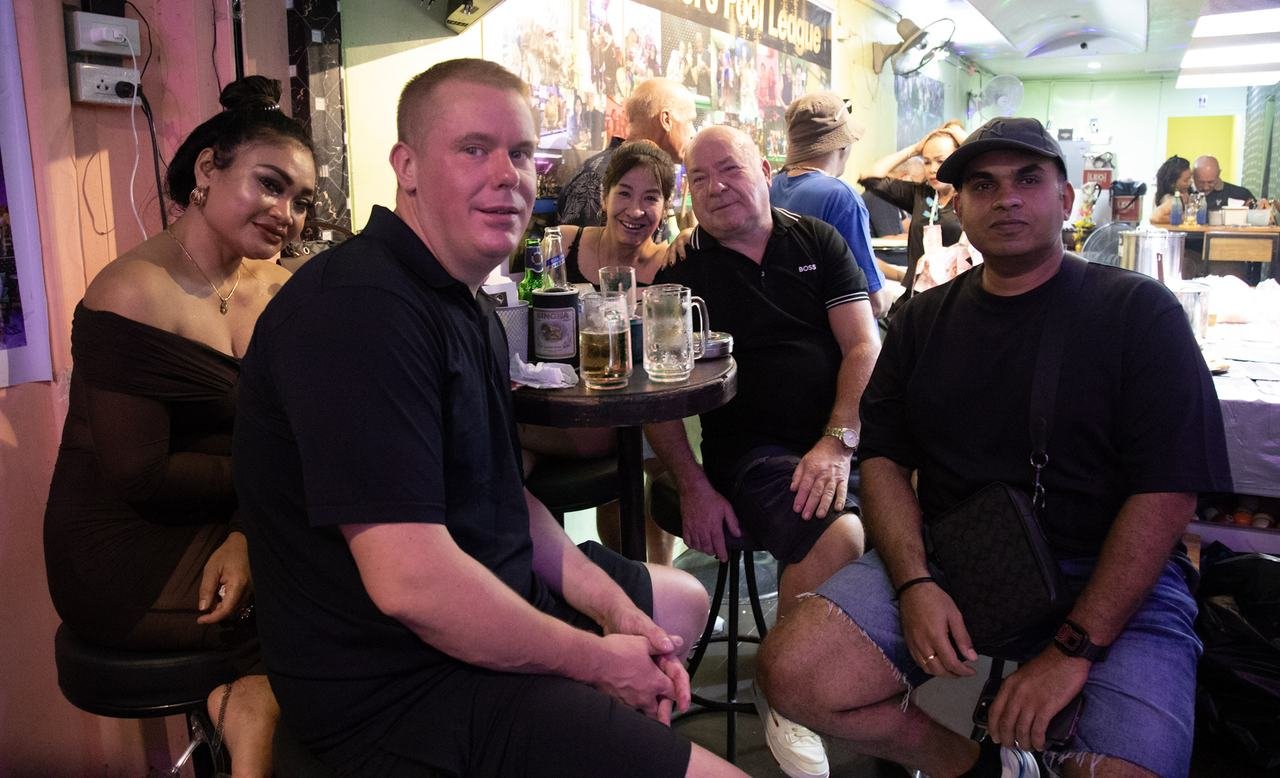 The whole table gathering for a group shot together
