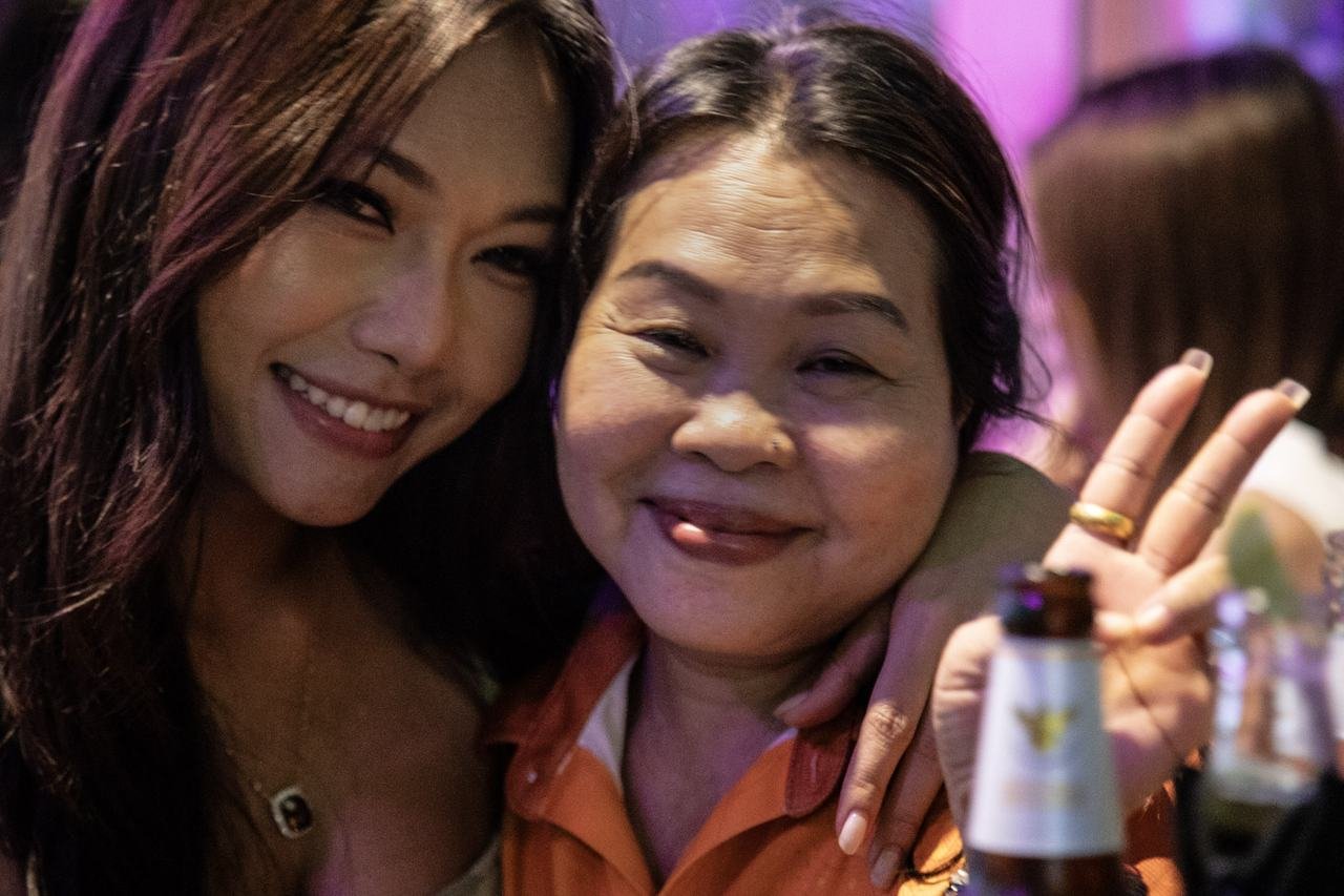 A joyful close-up between two friends celebrating