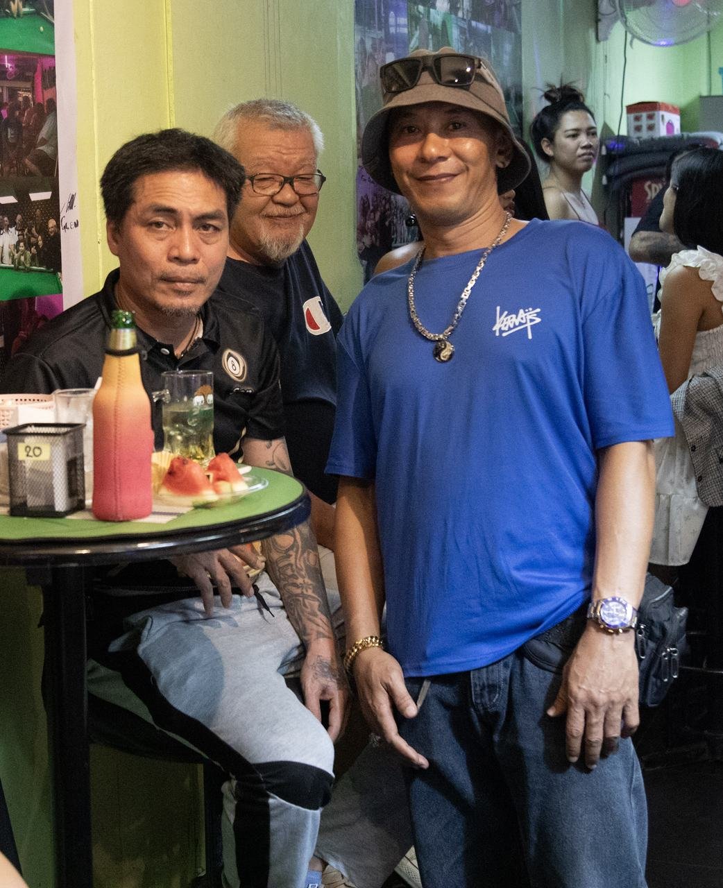 A casual moment shared with friends over drinks and fruit